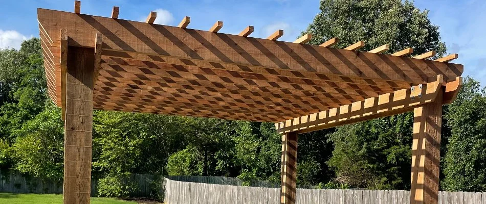 Wooden pergola on an outdoor living space in Memphis, TN.
