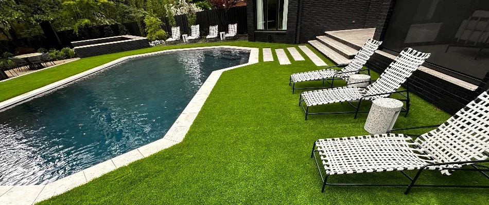 Green synthetic turf around a pool in Memphis, TN.