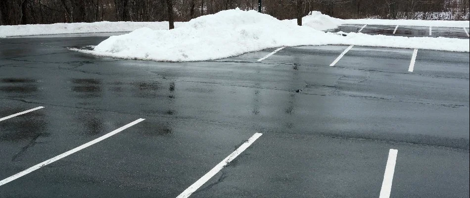 Snow pushed to the side of a parking lot in Memphis, TN.